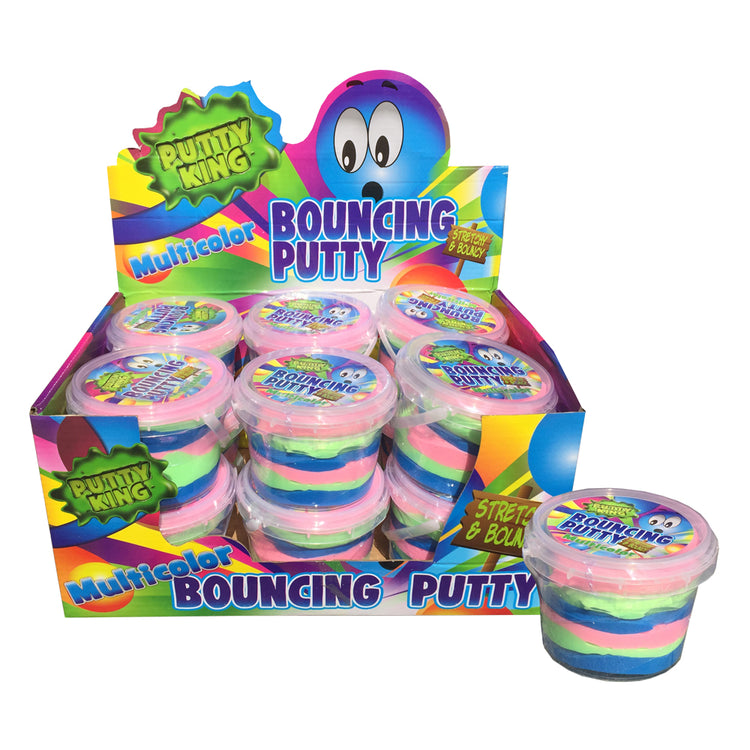 Eine Displaybox von www.buyon.at mit mehreren kleinen Plastikbehältern ihres Bouncing Putty, mehrfarbig. Die Behälter sind farbenfroh verpackt, mit großem Text und einer Zeichentrickfigur. Ein Behälter, der den Batikeffekt des Knetes im Inneren zeigt, steht zur Ansicht außerhalb der Box.