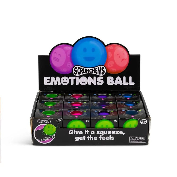 Eine Displaybox mit Emotions Squish Ball-Spielzeugen von www.buyon.at zur sensorischen Stimulation. Die Box enthält neun Reihen mit leuchtenden Stressbällen in Grün, Lila und Pink, die jeweils einzigartige Gesichtsausdrücke zeigen. Auf der Box steht: „Drücken Sie, um die Gefühle zu spüren.“ Geeignet für Kinder ab 3 Jahren.