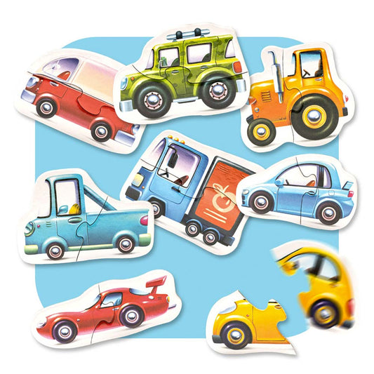 Das Puzzle „Fahrzeuge“ von www.buyon.at enthält eine Sammlung farbenfroher Teile, darunter einen roten Sportwagen, einen grünen SUV, einen gelben Traktor, einen blauen Lieferwagen, einen blauen Kleinwagen und sogar ein faszinierendes kaputtes gelbes Autoteil – alles vor einem blauen Hintergrund mit hochwertiger Verarbeitung für Kinder.