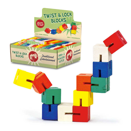 Ausgestellt ist ein farbenfrohes Set von Holzspielzeug Twist & Lock Blocks von www.buyon.at. Die bunten Holzblöcke sind miteinander verbunden und bilden eine Zickzack-Form. Die Verpackung im Hintergrund zeigt die Blöcke in verschiedenen Farben und trägt die Aufschrift „Twist & Lock Blocks – Traditionelle Unterhaltung“.